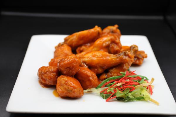 Hot Wings · Regular or boneless chicken wings. Pick up to 2 flavors. Crispy (cauliflower) not wings available. Add non dairy cheese and sour cream for an additional charge. Plant based friendly.