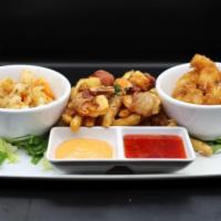 Shrimp Sampler · Shrimp 3 ways mojo, crispy coconut, wrapped in bacon laid on mojo fries with a chipotle aiol...