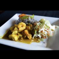 Shrimp Curry · Served with rice and peas and sauteed vegetables.
