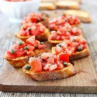 Bruschetta · Served with toasted Italian bread topped with roma tomato, garlic and fresh basil marinated ...