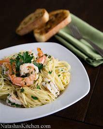 Shrimp Scampi Pasta · Shrimp scampi tossed with garlic, parsley, chopped onion and lemon served in a white wine sauce with a touch of Marinara served over Angel hair pasta. All pastas are served with garlic bread.
