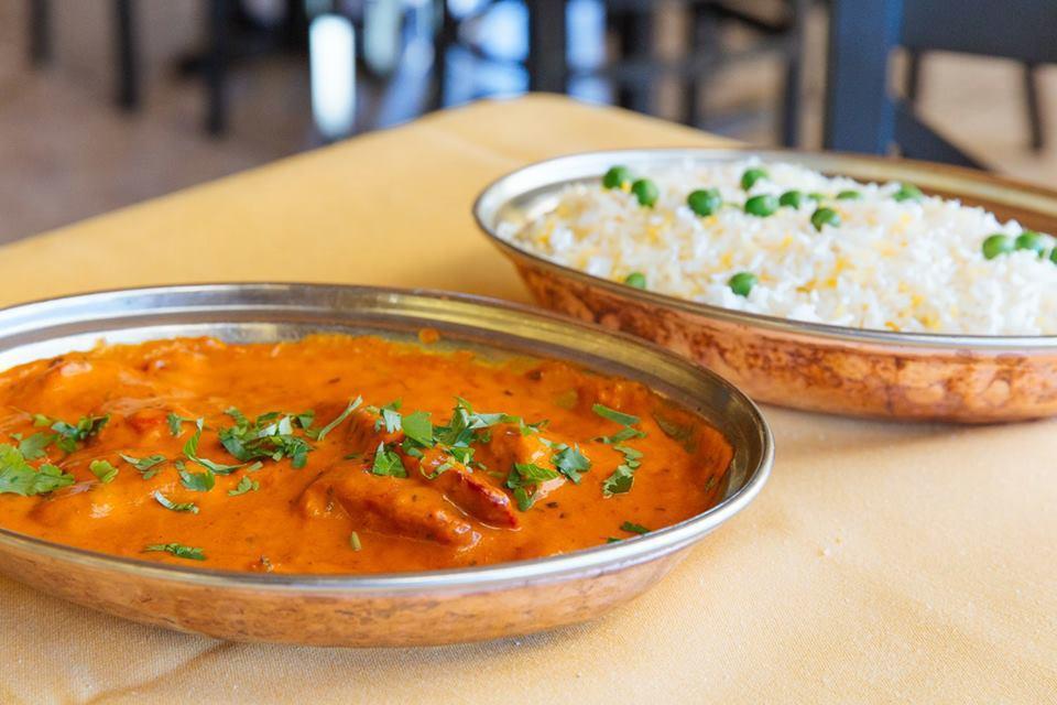 Butter Chicken · Tandoori chicken (boneless dark meat) pieces cooked in a tangy tomato sauce. Served with basmati rice.