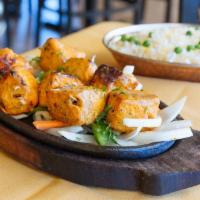 Tandoori Salmon Tikka · Fresh salmon fillets marinated with yogurt and light spices and cooked to perfection in the ...
