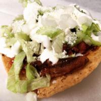 Tostadas · Delicious flat hard shell tortilla with any choice of protein. With refried beans, lettuce, ...