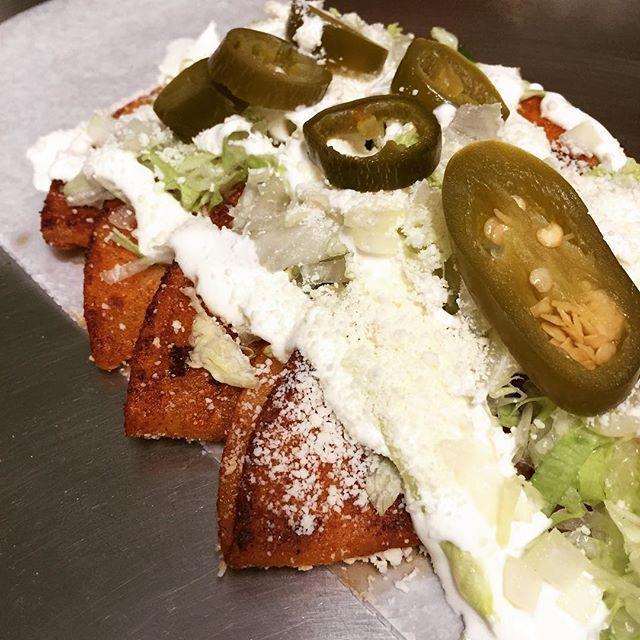 Verdes and Rojas Enchiladas · 4 Enchiladas -Our Enchiladas are made with preference of red or green sauce, sauté tortilla rolled up filled with any protein of choice. Finish with the traditional lettuce, onion, sour cream & queso cotija.