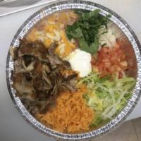 Bowl · A delicious way to savor more the meats without the tortillas. Our bowls contain rice, bean,...