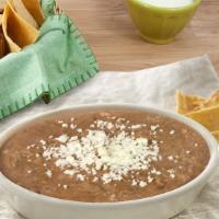 Frijoles · Mexican refried pinto beans cooked with NO LARD.