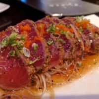 Tuna Tataki · Seared slices of pepper tuna served with special sauce.