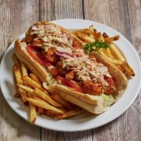 Fried Shrimp Sandwich · Served on a french roll with mayonnaise, creole mustard, lettuce, tomato and Cajun trinity, ...