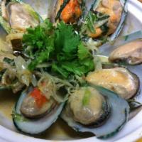 Mussel de Coco · New Zealand green mussels, lemon grass kaffir lime leaves, cilantro and Thai basil simmered ...