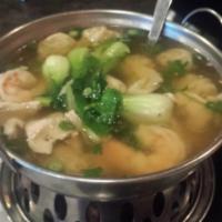 43. Wonton Soup · Homemade wonton topped with sliced chicken and shrimp wonton with bok choy in chicken broth.