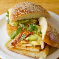 Cemitas Poblanas · Panko crusted chicken filet with mayo, chipotle peppers, queso fresco, onion and avocado on ...
