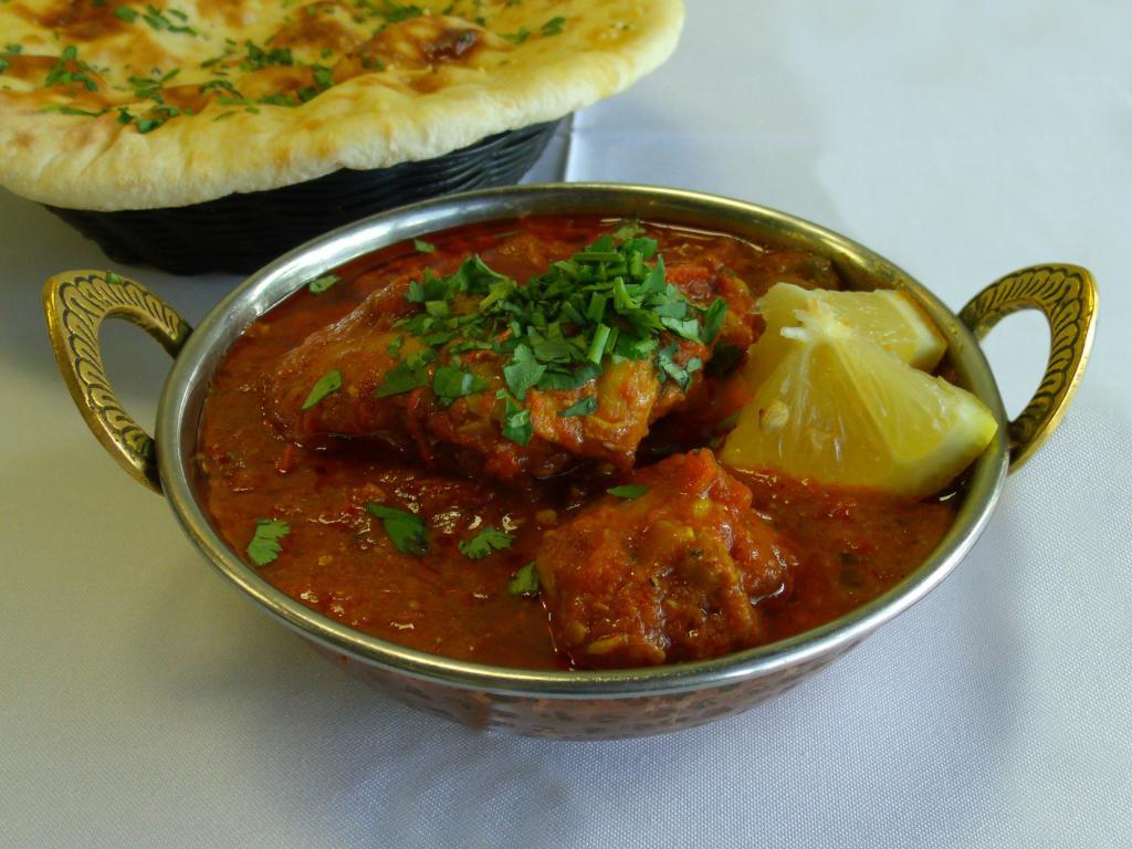 7. Karahi Gosht Curry · Goat meat with fresh tomatoes more taste and desi spices. Served with naan. Regular Spicy.