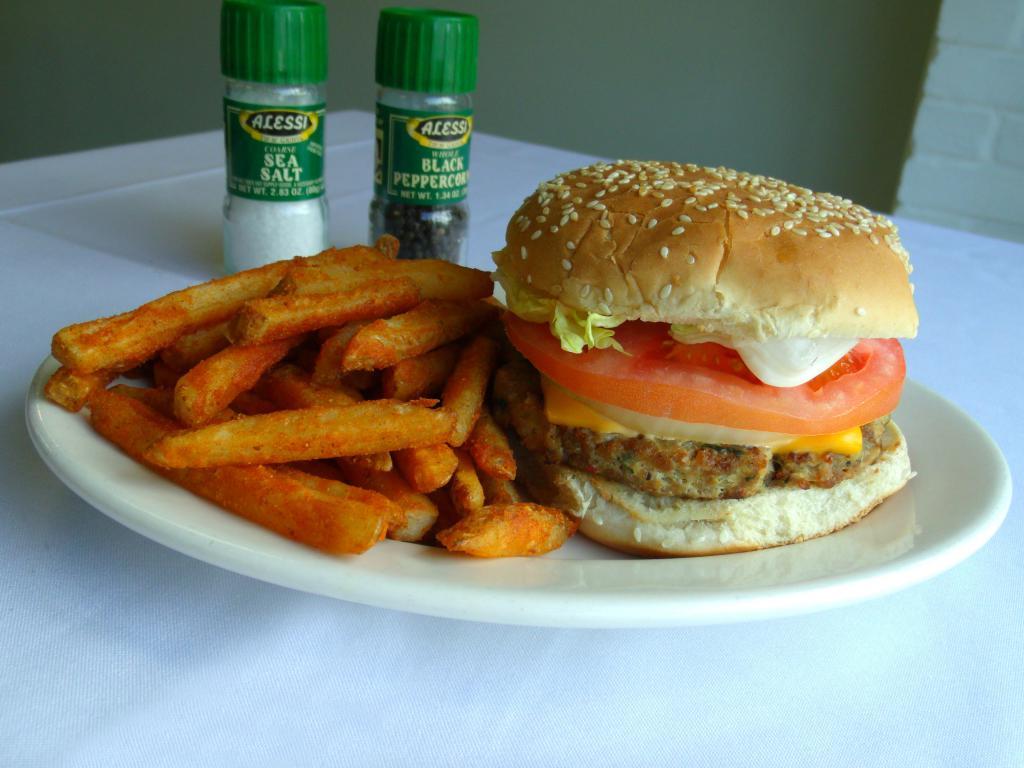 40. Chicken Burger · Grilled chicken patty with onion, tomato, pickles, Jalapeno and desi spices.