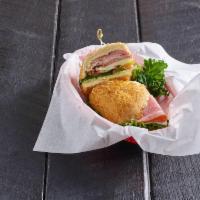 The Classic Sandwich · Ham, turkey, roast beef, and cheddar with mayo, yellow mustard, herbed olive oil, romaine le...