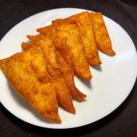 Crab Rangoon (6) · Stuffed with cream cheese, onion and crab meat, deep fried.