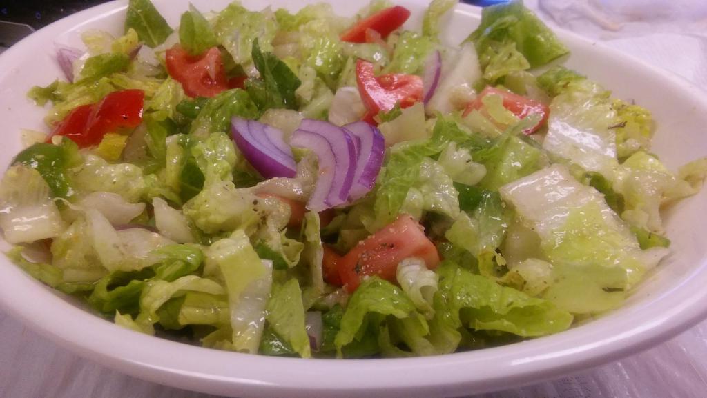13. house  Salad with lettuce · Romaine lettuce with onions, tomatoes and jalapeno pepper served with house dressing.