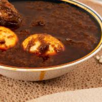 20. Doro Wot · Traditional dish, chicken stew (with one leg and two eggs) simmered in berbere sauce and her...