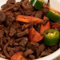 23. Lega Tibs · Tender beef cubes sauteed with rosemary, onion and green peppers with a mint of specialty se...