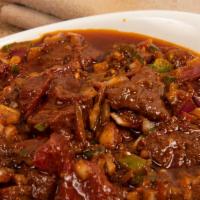 32. Gored Gored · Chunked beef lightly cooked sauteed with onion and jalapeno with herbal butter and awaze. Se...