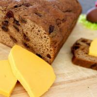 Bun and Cheese · A slice of Jamaican cheddar cheese between two slices of spiced bun with raisins makes a del...