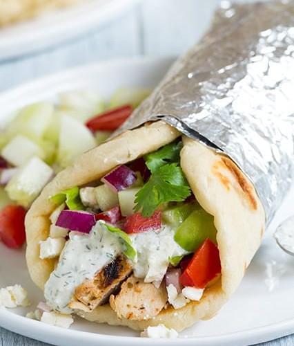 Chicken Gyro · Tender chicken served in pita bread, topped with fresh lettuce, tomatoes and onion. Drizzled with tahini or cucumber sauce. Served in pita bread.