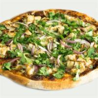 BBQ Chicken Pizza · BBQ sauce, chicken breast, red onions, fresh cilantro and mozzarella cheese.