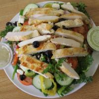 Greek Salad with Grilled Chicken · Marinated grilled chicken breast on top of Greek salad served with homemade Greek dressing.
