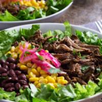 Barbacoa Bowl · Made with 100% all natural grass fed beef; includes Spanish Rice, Black Beans, Lettuce, Pico...
