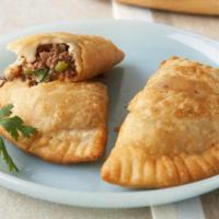 Gourmet Grande Beef & Cheese Empanada · Our famous signature Cattlemen's grass fed beef straight from the heart of Texas combined wi...