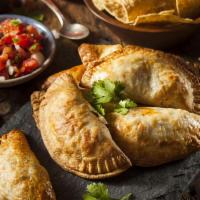 Gourmet Grande Spicy Beef & Cheese Empanada · Our famous signature Cattlemen's grass fed beef, cheese and habanero salsa combined straight...