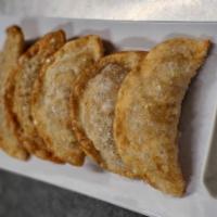 Mandu (dumplings) · Choice of MEAT, VEGETABLE, KIMCHI & PORK or KIMCHI & VEG housemade dumplings (10). (Steamed ...