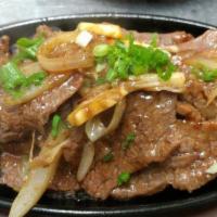 Galbi · Sliced Marinated Beef Short Rib - Barbecue items come with a side of rice, green leaf lettuc...