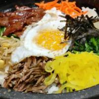 Gopdol Bibimbap DINNER · Lightly seasoned mixed vegetables, ground beef, fried egg over crisped rice from cooking in ...