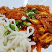Ohjing Uh Bokkeum · Stir fried pieces of squid with mixed vegetables in a spicy and sweet sauce, garnished with ...