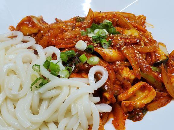 Ohjing Uh Bokkeum · Stir fried pieces of squid with mixed vegetables in a spicy and sweet sauce, garnished with a side of udon noodles. FOR GLUTEN FREE, ASK FOR NO NOODLES. Very popular item.