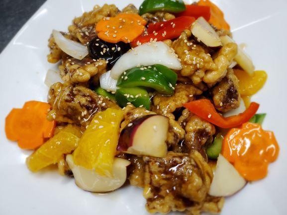 Tang Soo Yook · Deep fried diced pork with stir fried a sweet & sour sauce with mixed vegetables. Can substitute beef, chicken or shrimp.