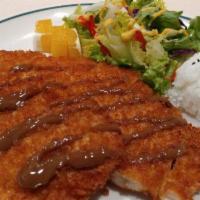 Fish Katsu · Fried breaded cutlet filet of sole fish, served with rice, donkatsu sauce, and small green s...