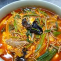 Yuk Gae Jang · Shredded beef brisket, scallions, Korean bracken fern vegetable, wood ear mushrooms, glass v...