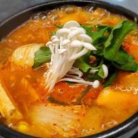Daegu Tang · Cod fish (on the bone) casserole with mixed vegetables in mild or spicy broth.  Choice of Sp...