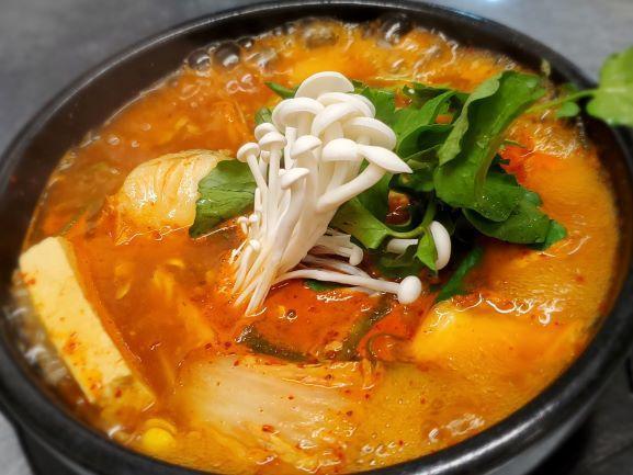 Daegu Tang · Cod fish (on the bone) casserole with mixed vegetables in mild or spicy broth.  Choice of Spicy or NOT Spicy.  Very popular item.