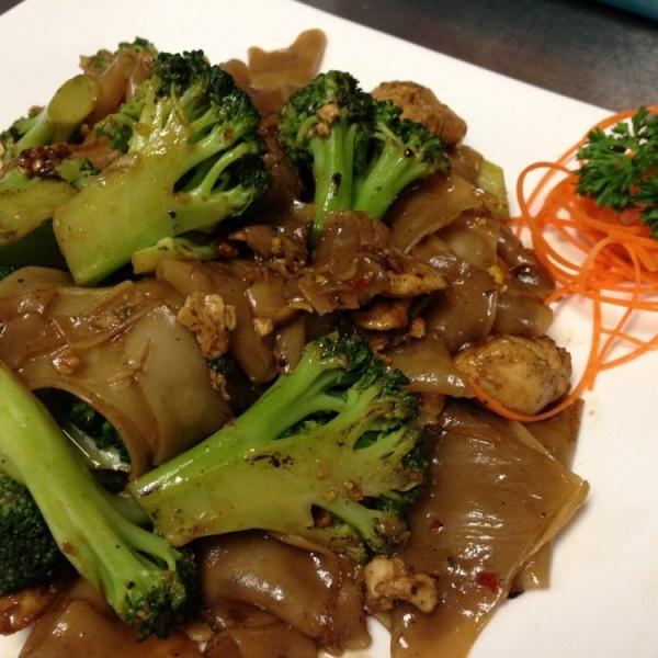 Pad See Ewe · Stir-fried fresh wide rice noodles with choice of meat, egg, broccoli, fried garlic and house sauce.