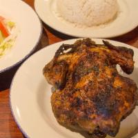 Pollo Entero · Whole Peruvian Rotisserie Chicken. Served with house salad and side.