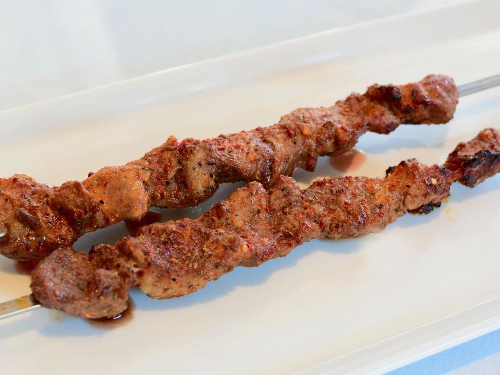 Uyghur Lamb Kabab (Per Skewer) · Chopped lamb sprinkled with cumin, house spices and sauce.