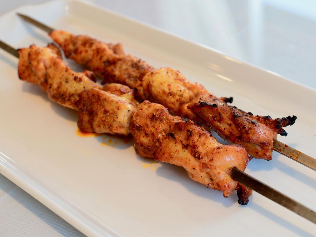 Uyghur Chicken Kabab (Per Skewer) · Chopped chicken sprinkled with cumin, house spices and sauce.