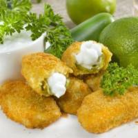Stuffed Jalapenos · 6 pieces stuffed with cheddar cheese
 Served with ranch dressing.