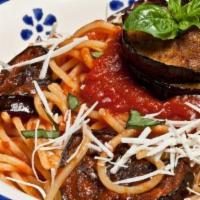 Eggplant Parmigiana · Lightly breaded sliced of eggplant served on a bed of spaghetti with our hearty tomato sauce...