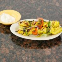C2. Chicken Kabob Plate · Served with fresh pita bread. Two grilled skewers of tender chicken breast chunks.