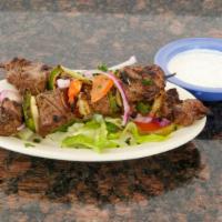 C3. Lamb Kabob Plate · Served with fresh pita bread. Two grilled skewers of tender lamb chunks.