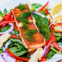 Grilled Salmon Salad · Grilled salmon served on fresh spinach with red onions, red bell peppers, artichoke, dill, a...